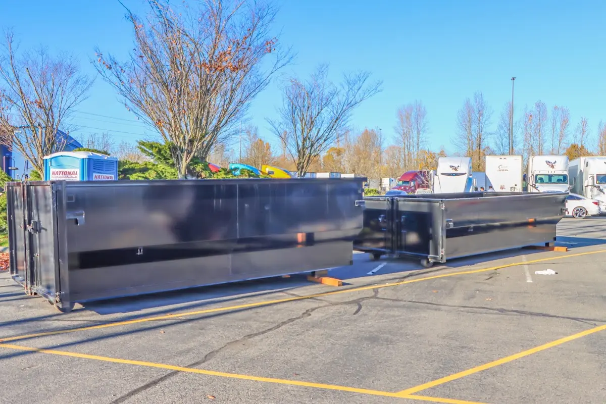 Professional dumpster rental service with roll-off container on residential driveway in Wilmington Island